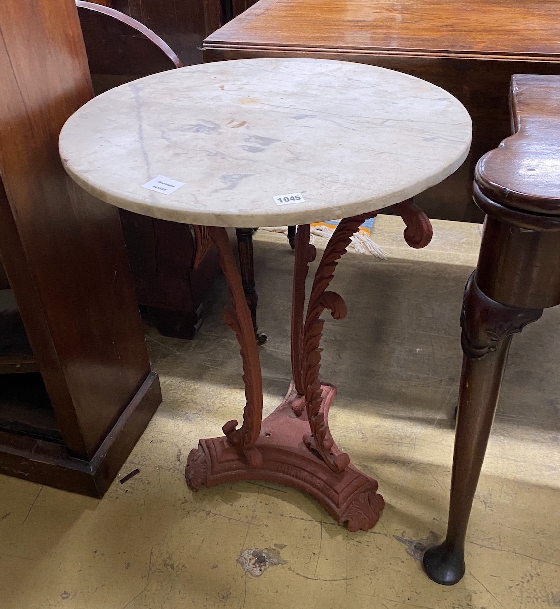 A Victorian style painted cast metal circular top marble top table, diameter 56cm, height 70cm